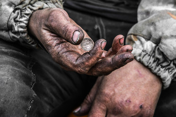 Homeless poor man with one cent coin in the street - obrazy, fototapety, plakaty