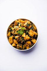 Fenugreek potato sabzi or Aloo Methi masala is healthy Indian Cuisine. served in a bowl or karahi. selective focus