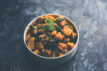 Fenugreek potato sabzi or Aloo Methi masala is healthy Indian Cuisine. served in a bowl or karahi. selective focus