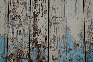 texture of wooden boards with cracked exfoliating old paint