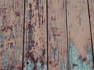 texture of wooden boards with cracked exfoliating old paint