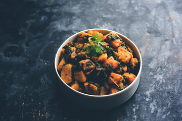 Fenugreek potato sabzi or Aloo Methi masala is healthy Indian Cuisine. served in a bowl or karahi....
