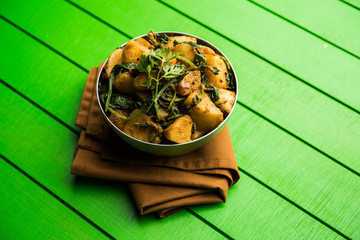 Aloo Palak sabzi - Potato cooked with spinach with added spices. a healthy Indian main course...