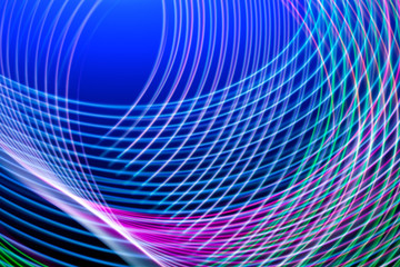 Fototapeta premium Abstract light blue, pink and purple trails in random motion background image. Striped Neon Lights in Rainbow Colors