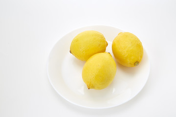 Lemons on a white plate