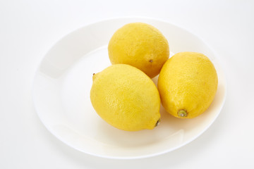 Lemons on a white plate