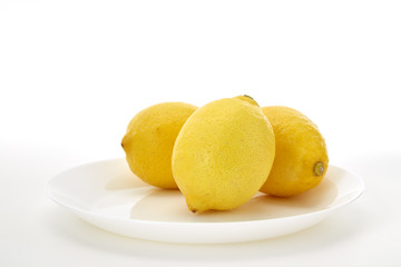 Lemons on a white plate