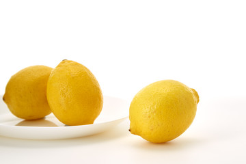 Lemons on a white plate