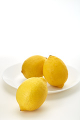 Lemons on a white plate