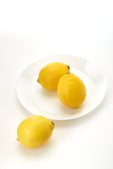 Lemons on a white plate