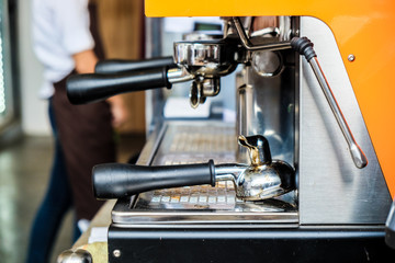 Coffee pouring machine close up in modern cafe