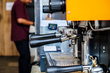 Coffee pouring machine close up in modern cafe