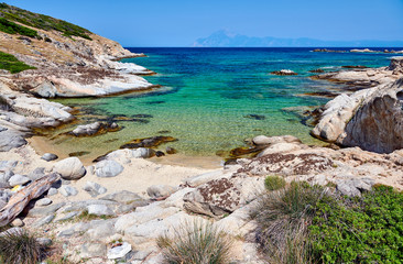 Fototapeta na wymiar Beautiful beach and rocky coastline landscape in Greece