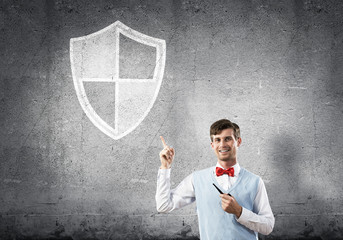 Elegant banker wearing red tie and shield sign as safety concept