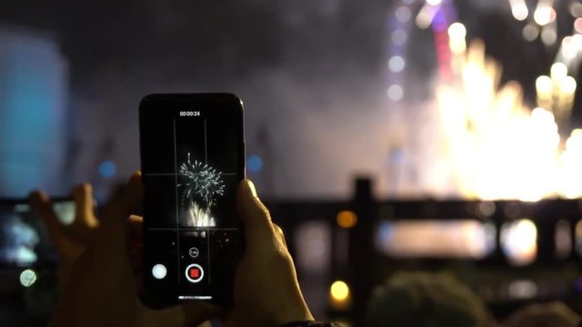 Cell phone filming London NYE fireworks in slow motion