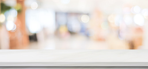 Empty white marble table over blur store background, banner, product display montage