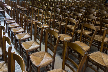 Chairs for parishioners in a catholic church.