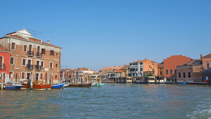 Fototapeta na wymiar Venice, Italy. Wonderful views through the water canals and the pedestrian street of the town