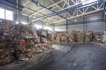 Plastic bales of rubbish at the waste treatment processing plant. Recycling separatee and storage...