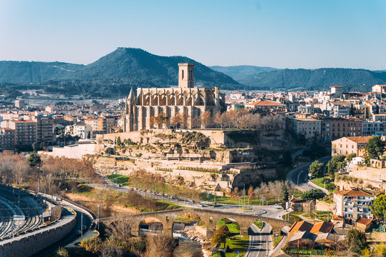 different and original view of Collegiate Basilica of Santa Maria Seu in Manresa city in catalunya region in Spain, with landscape of all the city