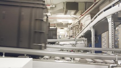 Boxes moving on conveyors in a large automated warehouse