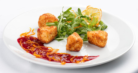 Camembert grill with arugula. On white background