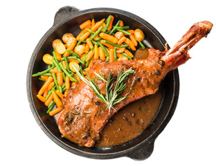 lamb leg with rosemary sauce with garnish of carrots and string beans