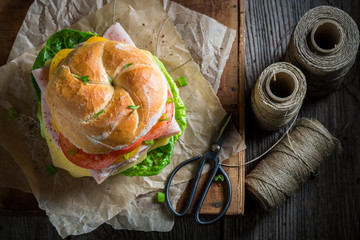 Top view of take away sandwich packed in gray paper