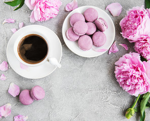 Pink peony with coffee and macarons