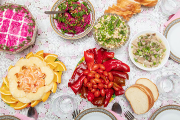 Salads and side dishes in plates on the table