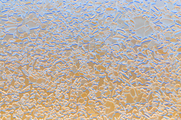 Snow patterns on glass as an abstract background