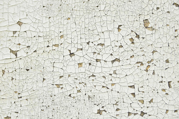 Cracked paint on light wooden background