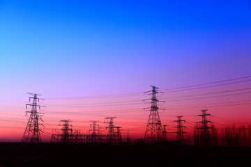 Fototapeta premium High piezoelectric towers, in the setting sun