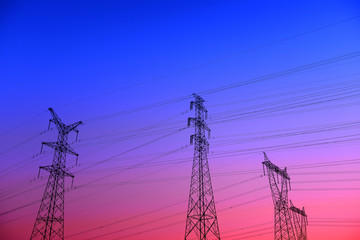 High piezoelectric towers, in the setting sun