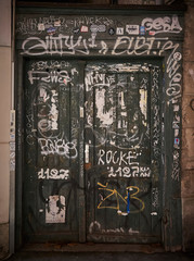 old wooden door with graffiti