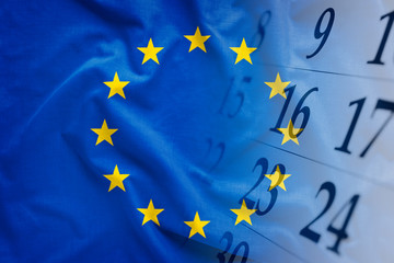 The flag of EU with calendar in the background