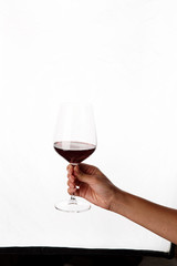 hand holding a glass of red wine