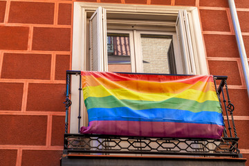 Homosexual rainbow flag on the balcony. street view. House with 