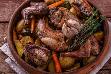 Close view of rabbit and potatoes in a pot