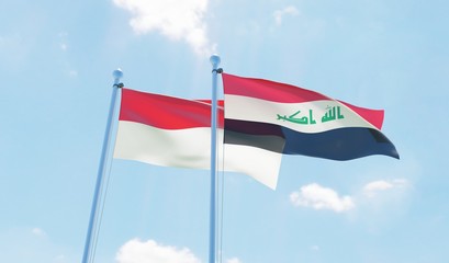 Indonesia and Iraq, two flags waving against blue sky. 3d image