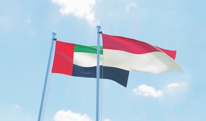 UAE and Indonesia, two flags waving against blue sky. 3D image