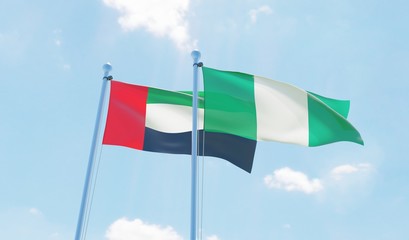 UAE and Nigeria, two flags waving against blue sky. 3D image