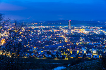 Germany, Ice cold winter night over glowing city lights of fellbach from above