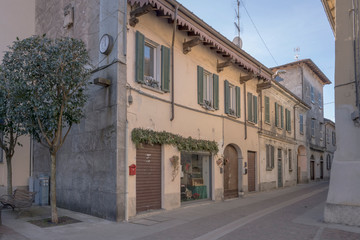 Fototapeta na wymiar old houses on cobbled street, Angera, Italy