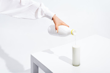 hand with a glass of milk