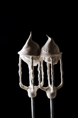 Mixer's whisks with beaten meringue on it