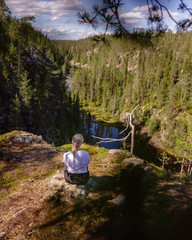 Blonde woman hiking in forest