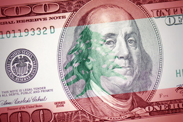 Obraz na płótnie Canvas flag of lebanon on a american dollar money background