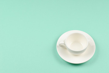Empty cup on a green background