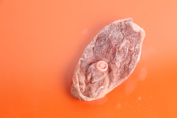 frozen lamb ribs on colorful background